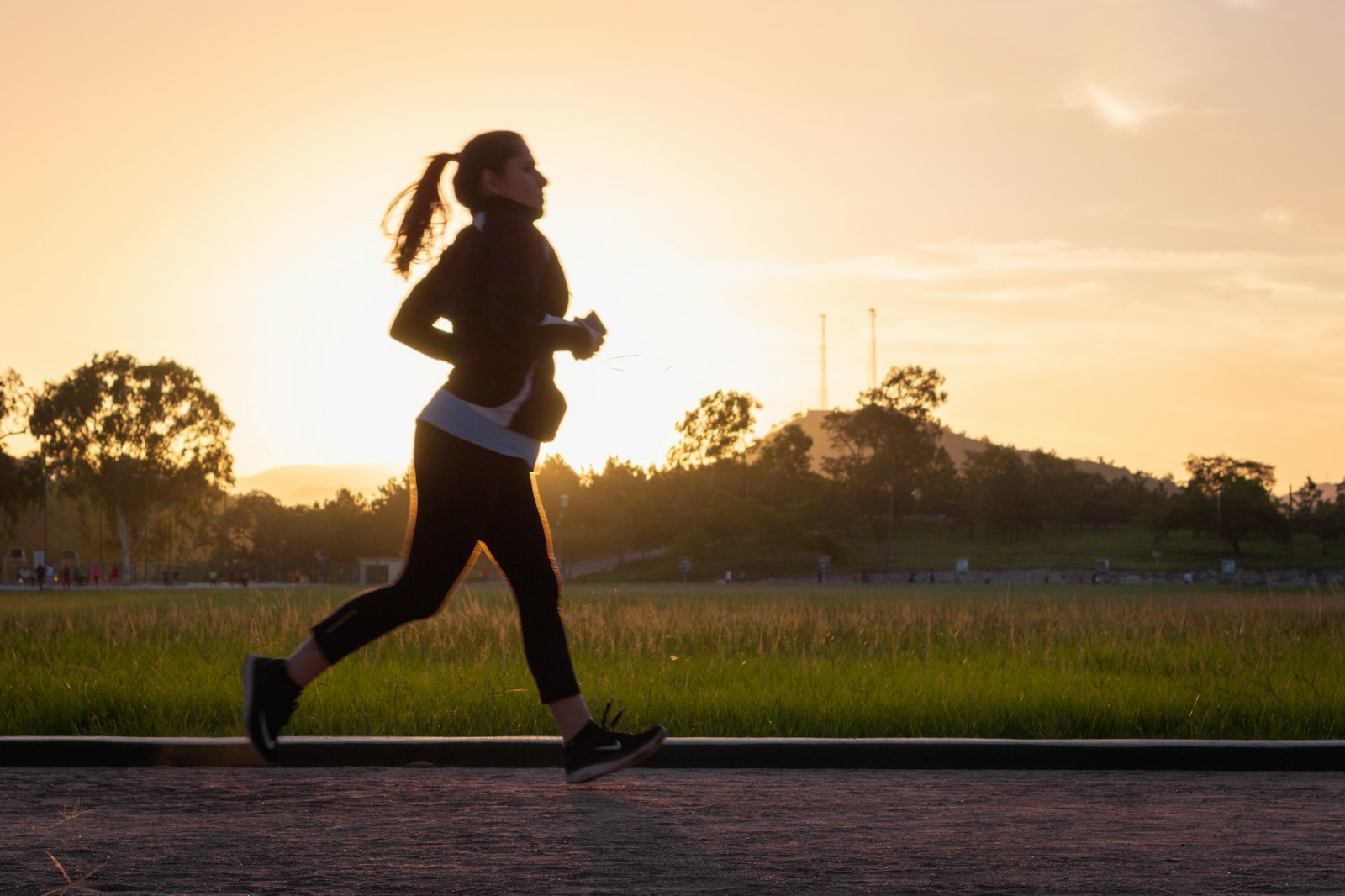 Runner on a path at sunset